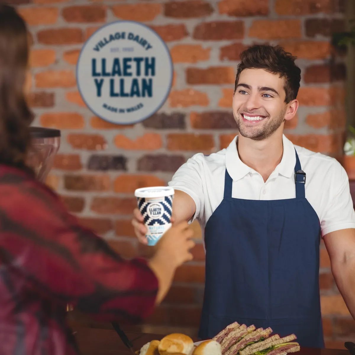 Wholesaller Handing over Yogurt